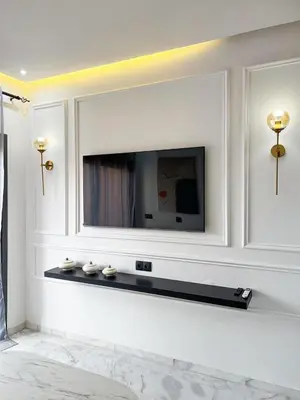a living room with a television on a wall at Luxe Studio Gueliz in Marrakech