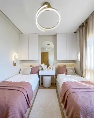 two beds in a room with a sink at Prestigia Saphir Luxury 3 Bedrooms, Pool & Golf View, near Airport in Marrakech
