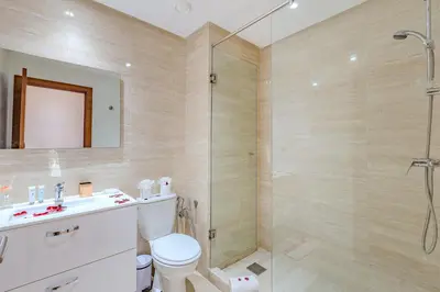 a bathroom with a shower and a toilet and a sink at Appât hôtel in Marrakech
