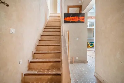 a stairway in a house with a staircase at Riad Dar Chalyia, private, 6 people, pool in Marrakech