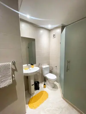a bathroom with a toilet and a sink and a shower at luxury Aprt2-bedrooms Pool hivernage heart of city in Marrakech