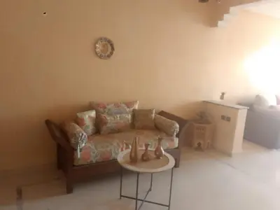 a living room with a couch and a table at Appartement au cœur de Gueliz in Marrakech