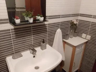 a bathroom with a sink and a mirror at Appartement au cœur de Gueliz in Marrakech