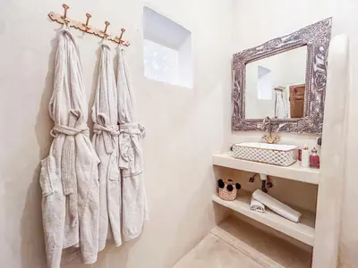 a bathroom with a sink and a mirror at Riad Sifaw & Spa Marrakech in Marrakech