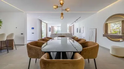 a dining room with a table and chairs at Villa jardin atlas in Marrakech