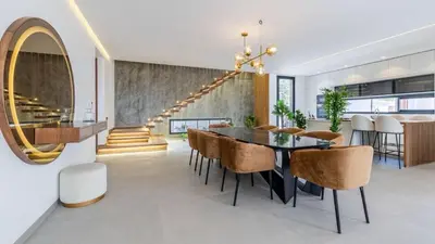 a dining room with a table and chairs at Villa jardin atlas in Marrakech