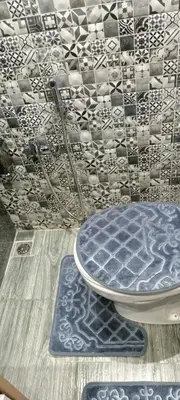 a table with a blue plate on top of a floor at Betterappart in Marrakech