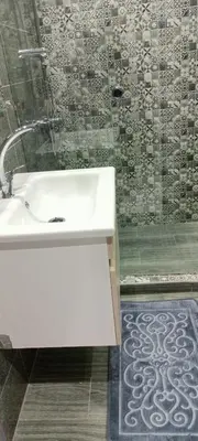 a bathroom with a white sink and a shower at Betterappart in Marrakech