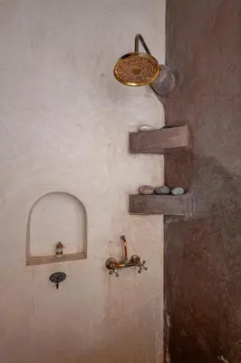 a room with shelves and a light on the wall at Riad GUENAOUA in Marrakech