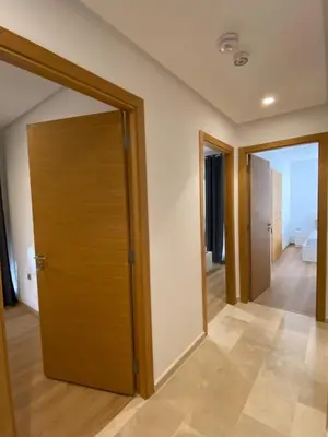 a room with a wooden door and a hallway at Breathtaking views of golf in Marrakech