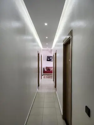 a corridor of a hallway with at Comfortable apartment near the Airport in Marrakech
