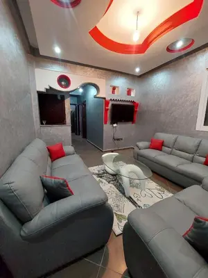 a living room with couches and a flat screen tv at Garden View in Marrakech
