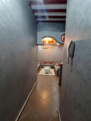 a hallway with a bathroom with a toilet in a room at Garden View in Marrakech