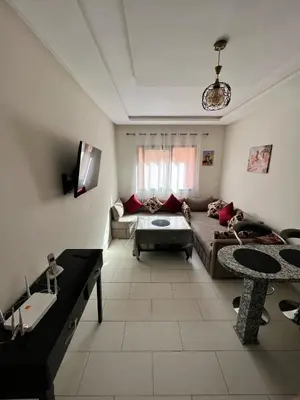 a living room with a couch and a table at Hoteghani in Marrakech