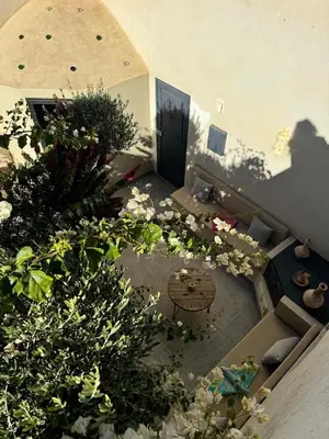 an aerial view of a garden with flowers and a door at Elegant Marrakech Villa with Optional Heated Pool for Ultimate Relaxation in Touggana