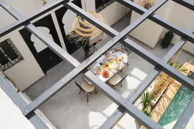 an overhead view of a table and chairs with food on it at Elegant Marrakech Villa with Optional Heated Pool for Ultimate Relaxation in Touggana