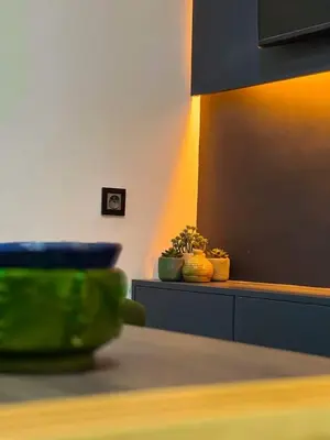 a room with a table with some plants on it at Hivernage appartement premium in Marrakech