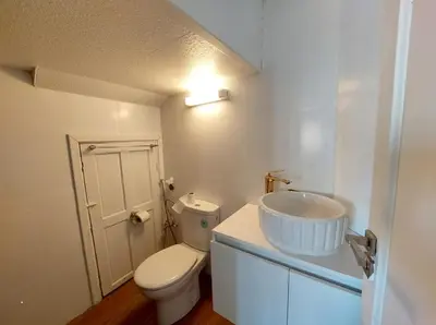 a white bathroom with a toilet and a sink at very nice house in Marrakech