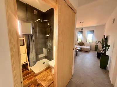 a bathroom with a shower and a toilet in a room at Appartement tout neuf à Gueliz Marrakech Plaza Zara in Marrakech