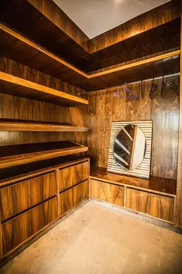 a room with wooden walls and a mirror at bianca in Marrakech