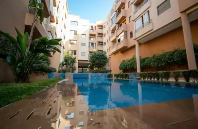 a swimming pool in the middle of a building at Comfort and Charm in Marrakech 6 min from Gueliz in Marrakech