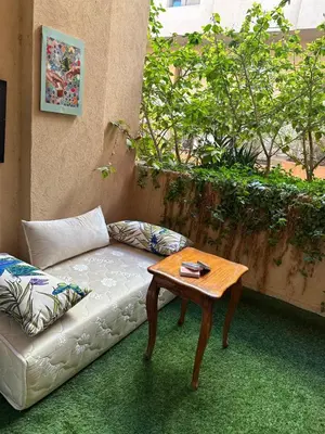 a living room with a couch and a table at Comfort and Charm in Marrakech 6 min from Gueliz in Marrakech