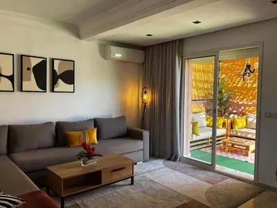 a living room with a couch and a table at Welcome to Chya House! in Marrakech
