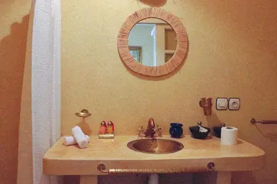a bathroom with a sink and a mirror at Riad Chez moi in Marrakech