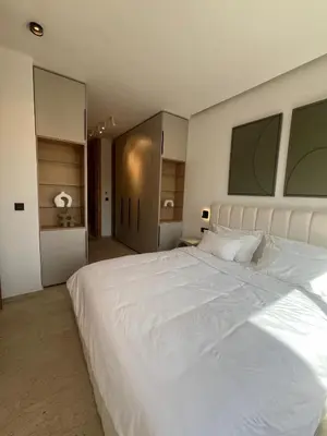 a bedroom with a large white bed in it at Dar Zohra in Marrakech