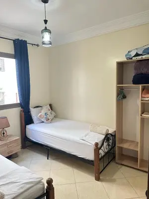 a bedroom with two beds in a room at Charming and Comfortable Room Near Marrakech Airport in Marrakech