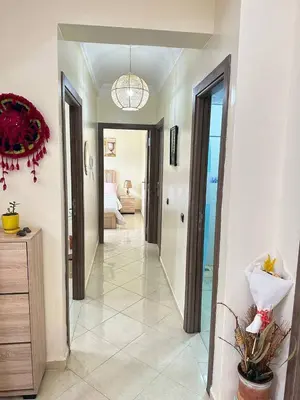 a hallway leading to a room with a living room at Charming and Comfortable Room Near Marrakech Airport in Marrakech