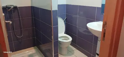 a bathroom with a toilet and a sink at Horizon Sérénité in Marrakech