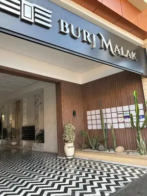 a store front of a building with a sign on it at Apparently 2 bedrooms- baby equipment in Marrakech
