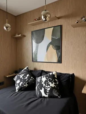 a living room with a couch with two pillows at Bohemian Chic Duplex Marrakech in Marrakech