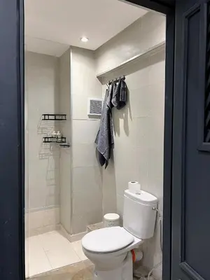 a bathroom with a toilet and a shower at Bohemian Chic Duplex Marrakech in Marrakech