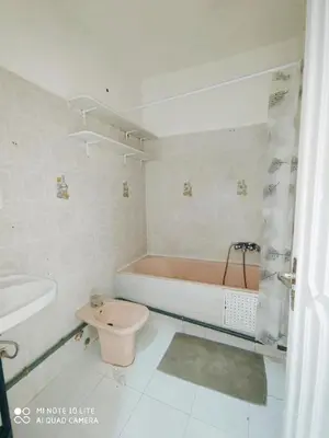 a bathroom with a tub and a toilet and a sink at Top Location Gueliz Centre in Marrakech