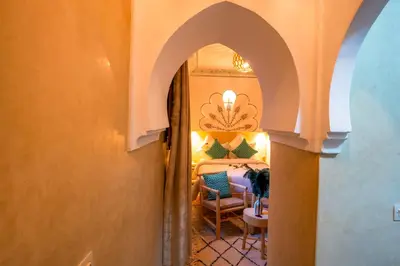 a bedroom with a king sized bed in a room at Riad Le Graff Pink in Marrakech