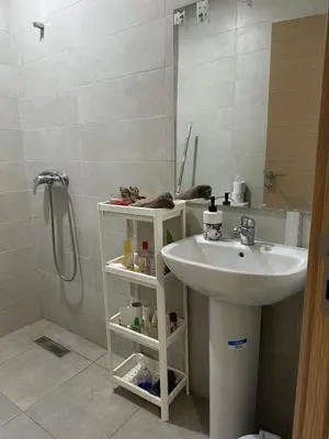 a bathroom with a sink and a shower at chiimappart in Marrakech