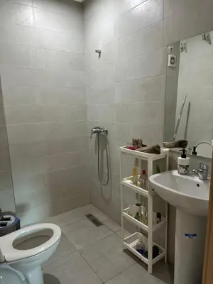 a bathroom with a shower and a toilet and a sink at chiimappart in Marrakech
