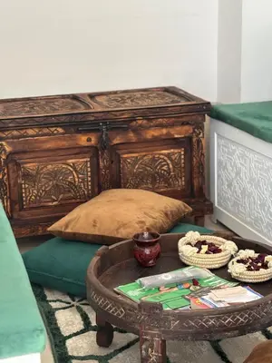 a bedroom with a bed with a table and a table sidx sidx sidx at Riad julines in Marrakech