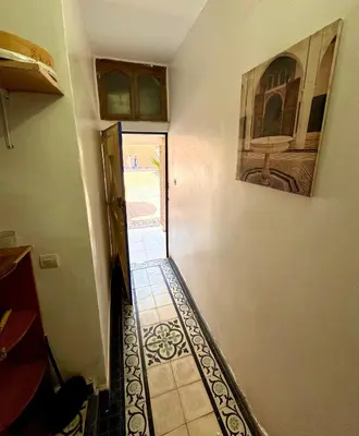 a hallway of a house with a tile floor at Maison au cœur de Marrakech in Marrakech