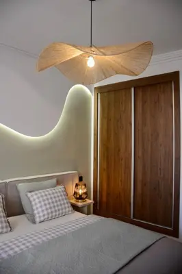 a bedroom with a bed with a large ceiling at Appartement Cosy et Moderne Accès 4 piscines in Marrakech