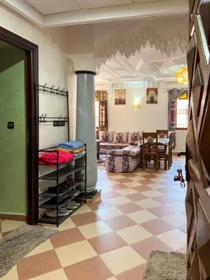 a living room with a couch and a fireplace at Moroccan culture Apt! Airport in Marrakech