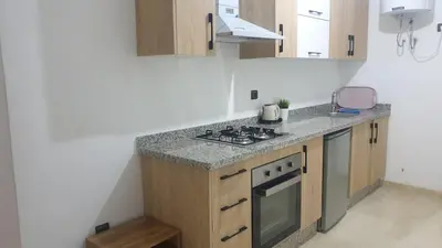a kitchen with a stove and a counter top at apartment 12 Marrakech centr gueliz in Marrakech