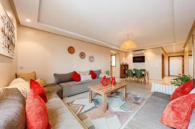 a living room with a couch and a table at Apartment center marrakech - Gueliz in Marrakech
