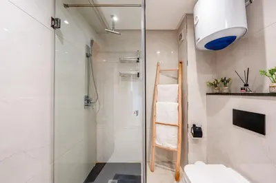 a bathroom with a shower and a glass shower backdoor at Apartment center marrakech - Gueliz in Marrakech