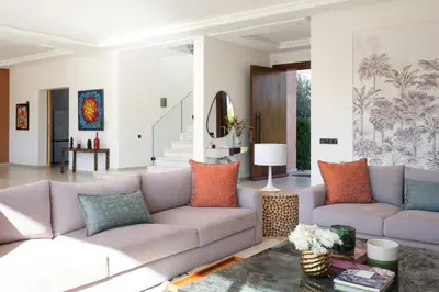 a living room with a couch and a table at La Salea - Golf Amelkis in Marrakech