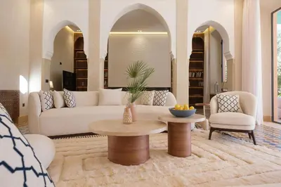 a living room with a couch and a table and chairs at Villa Amelya - Amelkis Golf in Marrakech