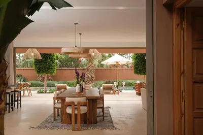 a dining room with a table and chairs at Villa Ty Habibi - Super 5 Bedroom with Private Heated Pool by the Golf Amelkis in Marrakech