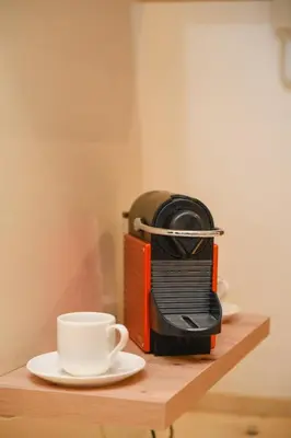 a toaster and a cup of coffee on a table at Chic & Modern in City Center - Pool, IPTV & Comfort in Marrakech